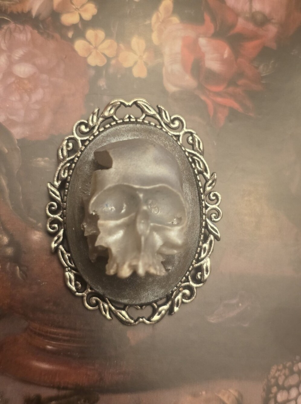 High Relief Set Skull Brooch On Grey Dusty Background In Silver Tone Frame